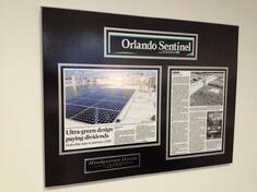 featrued article on green initiatives wall display