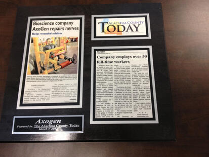 old newspaper articles, frame old newspaper clippings, plaques and awards